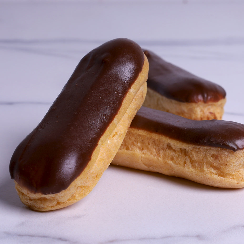 Small Eclair with Cream Dipped in Chocolate